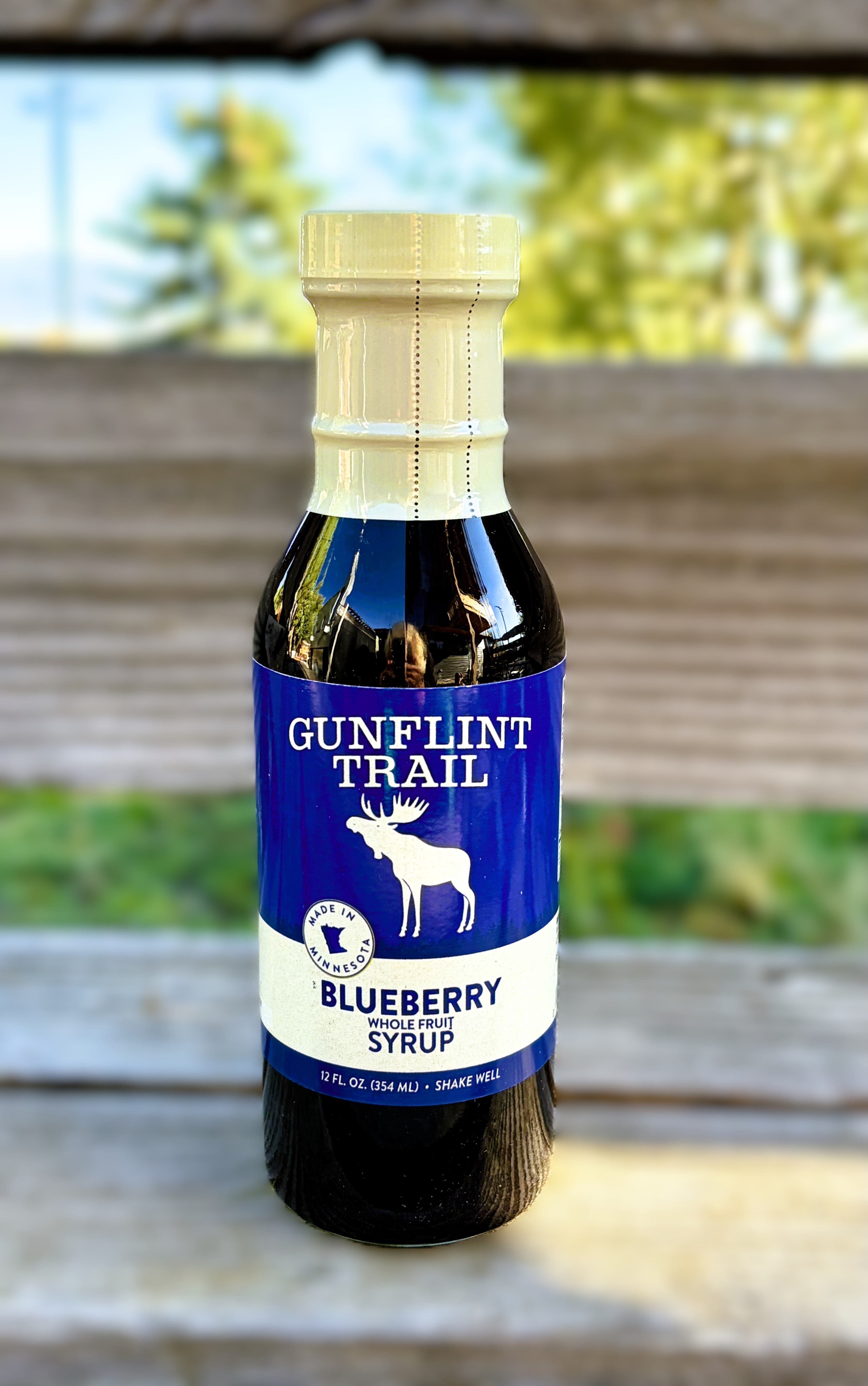 12 oz. glass bottle of Gunflint Trail whole fruit blueberry Syrup.