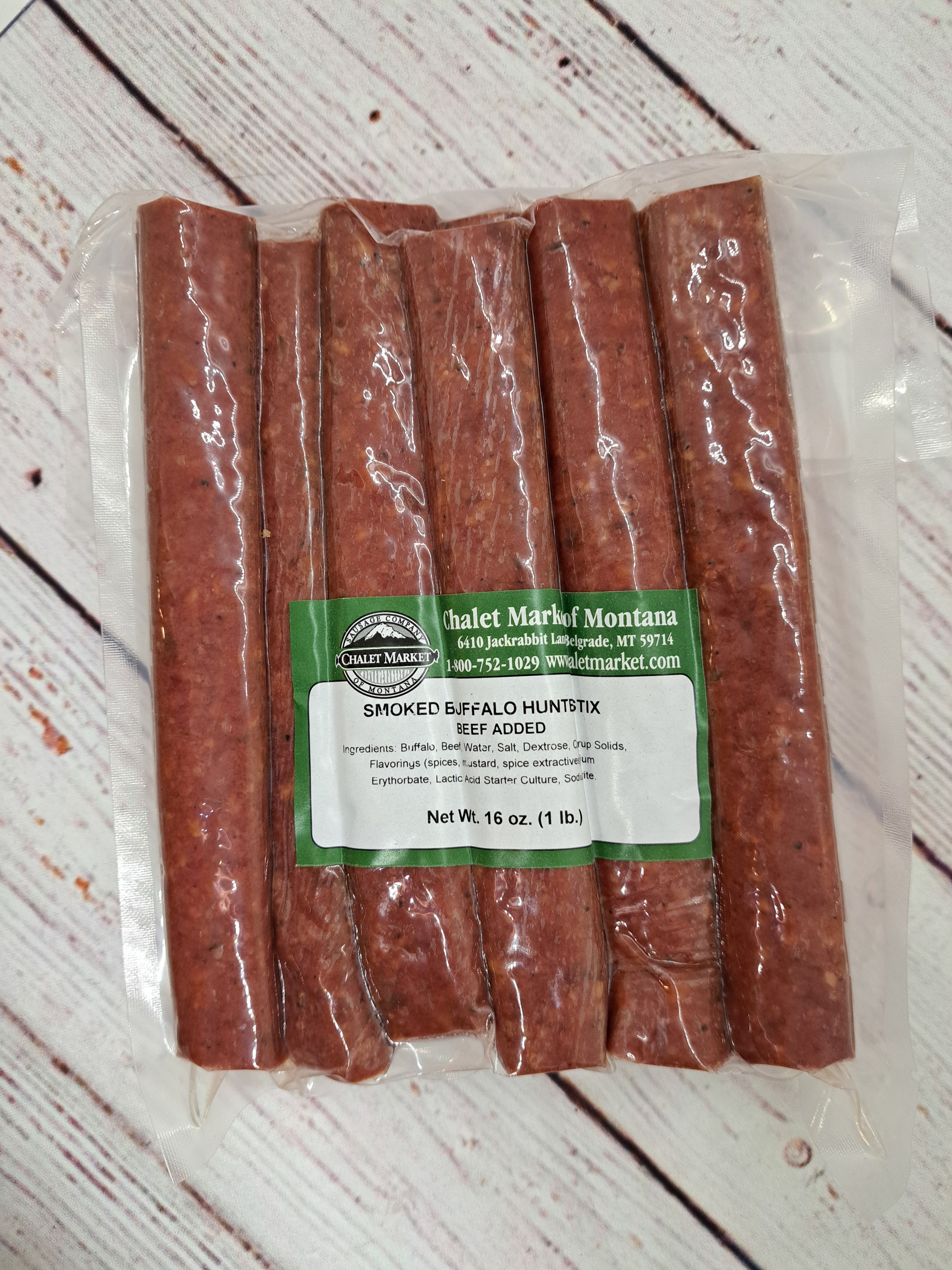 1lb package of Smoked buffalo Hunter Sticks with Beef added, Plastic packaging with green label. Chalet Market of Montana Buffalo Hunter Sticks 