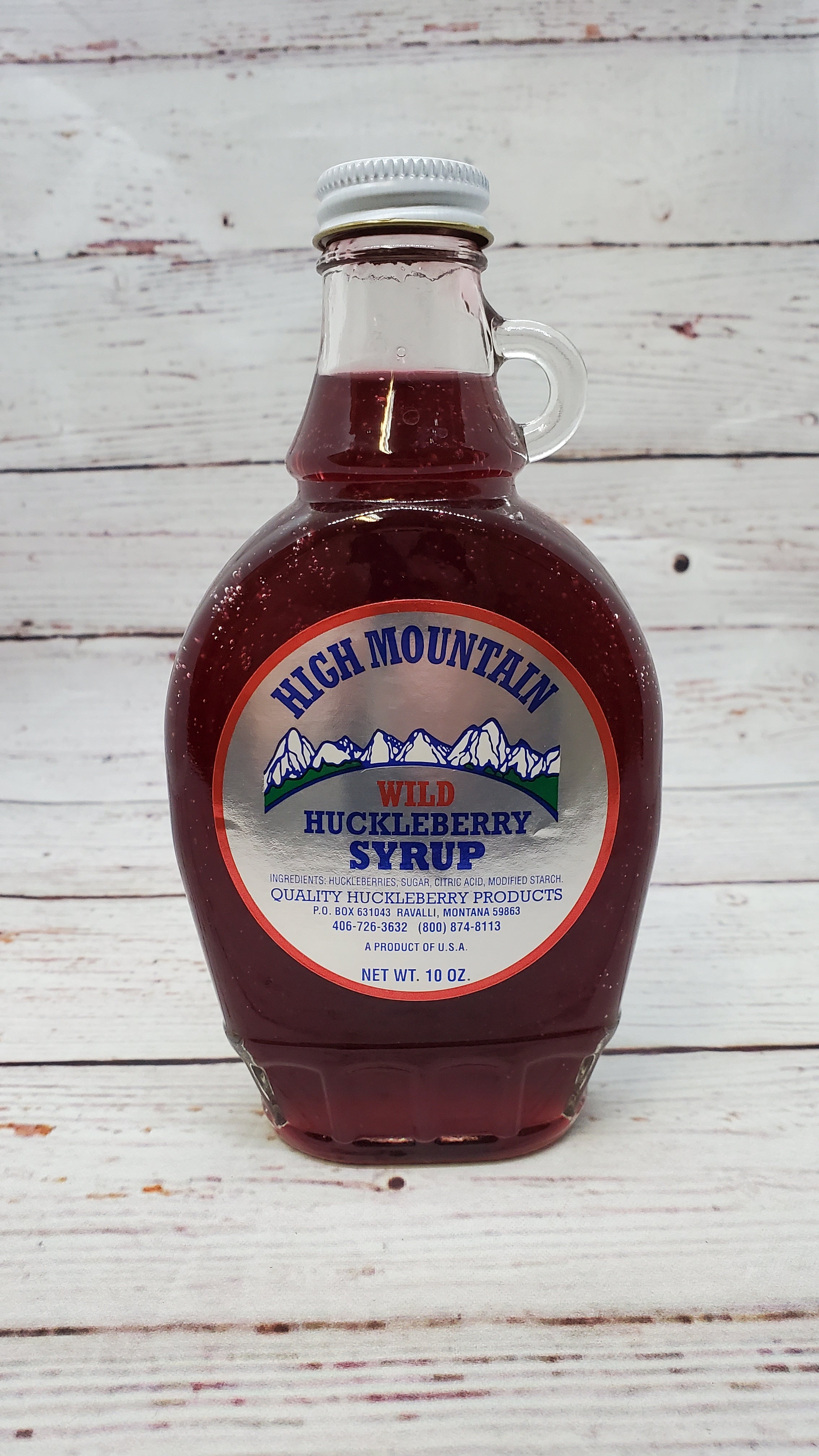High Mountain Quality Products from Ravalli, Montana Wild huckleberries are a hand-picked mountain delicacy Ingredients:  huckleberries, sugar, citric acid, and modified starch 10 oz glass jar Treat your pancakes, waffles, ice cream and other delights to a flavor blast.  From the beautiful Bitter Root Valley in northwest Montana we get this beloved Montana treat.  Tiny huckleberries grow wild on mountainsides and are treasured by humans and bears alike.  10 oz glass jar.