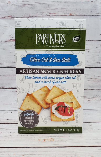 Partner's Olive Oil and Sea Salt Crackers  4 oz. package  Delicious thin & crisp cracker with a hint of natural sea salt   Made with non-GMO ingredients   A perfect addition to any gift box Partners is a family owned company  Allergy information:  Contains wheat and dairy  Partner's Olive Oil and Sea Salt Crackers 4 oz.  A delicious thin & crisp cracker-perfect with our summer sausages and cheese.  Made with non-GMO ingredients.  A perfect addition to any gift box.