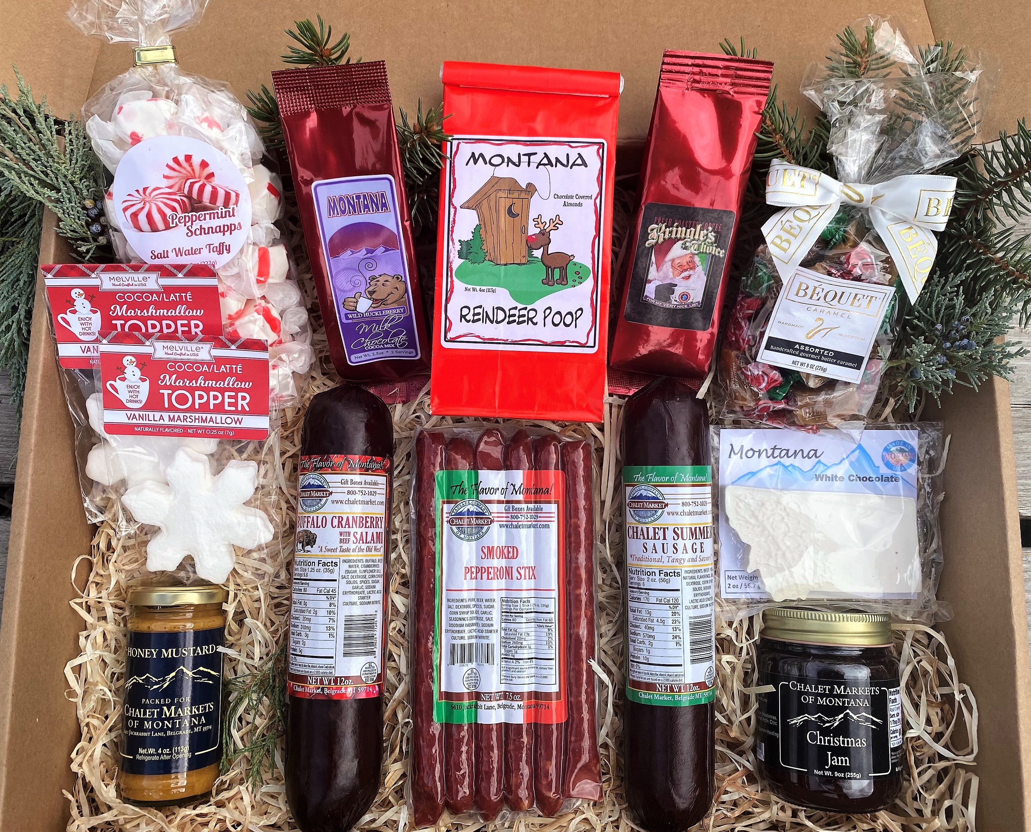 Montana Christmas Gift Box.  The perfect holiday gift for a family or office.  This gift offers a large assortment of Montana made gourmet food and Christmas themed goodies!  Made in Montana.