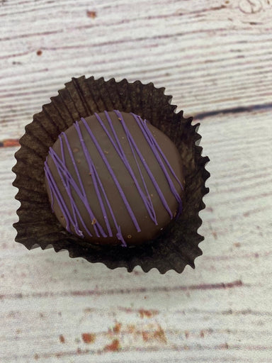 Dark Chocolate Huckleberry Honey Truffle. 1 oz. large truffle. Made in Wyoming.