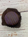 Dark Chocolate Huckleberry Honey Truffle. 1 oz. large truffle. Made in Wyoming.