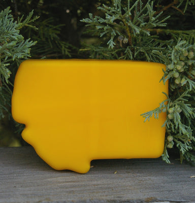 Yellow wax covered mild cheddar cheese in the shape of Montana.  4 ounces.